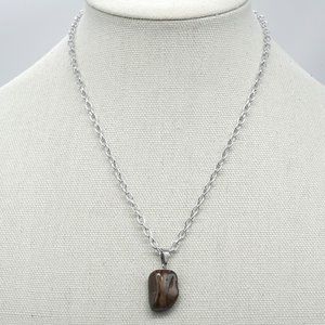 Necklace with brown stone.